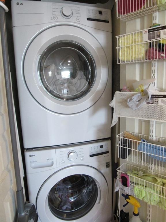 50 S Common St Unit 311, Lynn, MA 01902 - washroom featuring stacked washer / dryer