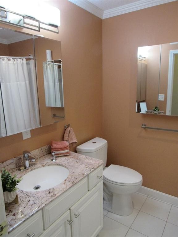 50 S Common St Unit 311, Lynn, MA 01902 - full bath with tile patterned floors, crown molding, vanity, toilet, and baseboards