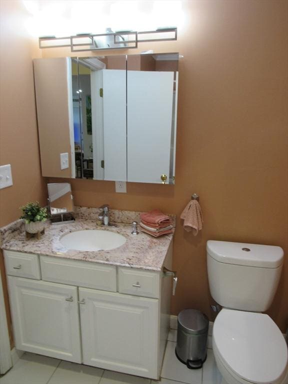50 S Common St Unit 311, Lynn, MA 01902 - half bath featuring vanity, tile patterned flooring, and toilet