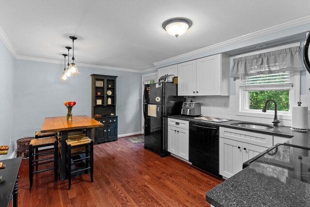 39 Taylor St Unit 39, Haverhill, MA 01830 - kitchen featuring black appliances, dark wood-style floors, white cabinets, tasteful backsplash, and crown molding