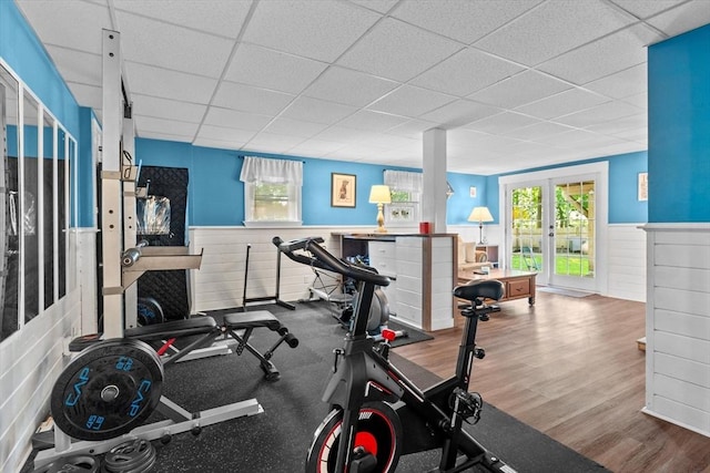 39 Taylor St Unit 39, Haverhill, MA 01830 - exercise room with a paneled ceiling, a wainscoted wall, healthy amount of natural light, and wood finished floors