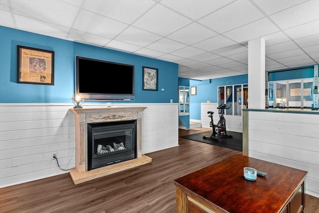 39 Taylor St Unit 39, Haverhill, MA 01830 - living area featuring a drop ceiling, wood finished floors, a wainscoted wall, and a fireplace