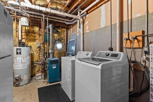 39 Taylor St Unit 39, Haverhill, MA 01830 - washroom featuring water heater, washing machine and clothes dryer, and a heating unit