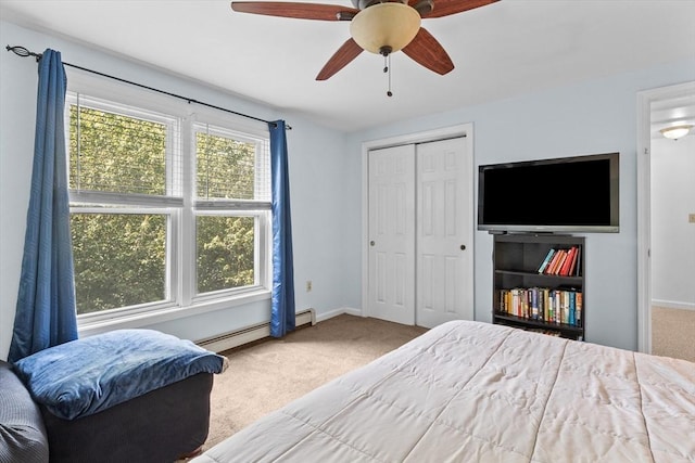 39 Taylor St Unit 39, Haverhill, MA 01830 - carpeted bedroom featuring a baseboard heating unit, a ceiling fan, and a closet