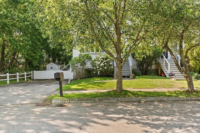 39 Taylor St Unit 39, Haverhill, MA 01830 - view of property hidden behind natural elements featuring asphalt driveway and stairway