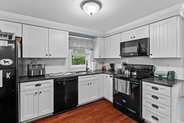 39 Taylor St Unit 39, Haverhill, MA 01830 - kitchen with black appliances, ornamental molding, white cabinets, tasteful backsplash, and dark wood-type flooring
