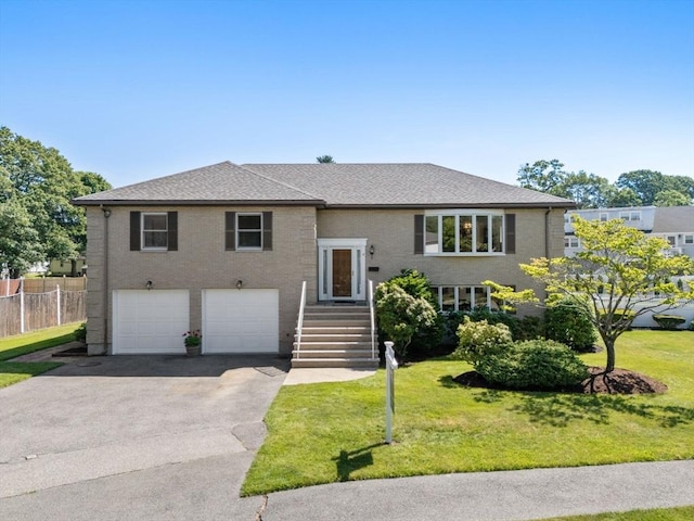 6 Gavin Cir, Stoneham, MA 02180 - bi-level home with driveway, an attached garage, and a shingled roof