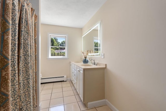 6 Gavin Cir, Stoneham, MA 02180 - bathroom featuring a baseboard radiator, double vanity, and tile patterned floors