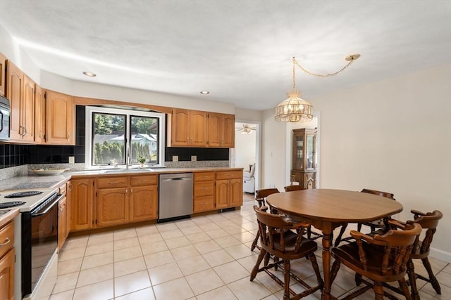 6 Gavin Cir, Stoneham, MA 02180 - kitchen with appliances with stainless steel finishes, backsplash, light countertops, a chandelier, and light tile patterned floors
