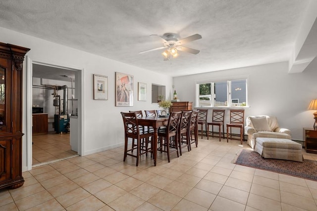 6 Gavin Cir, Stoneham, MA 02180 - dining space featuring ceiling fan, light tile patterned floors, baseboard heating, and a textured ceiling