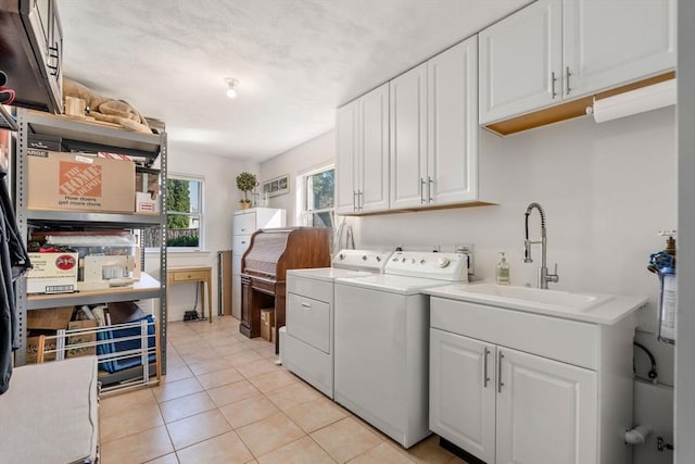 6 Gavin Cir, Stoneham, MA 02180 - laundry area featuring washing machine and dryer, cabinet space, and light tile patterned floors