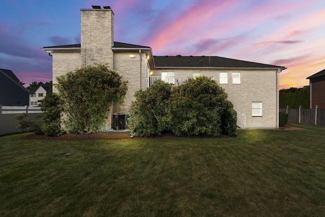 6 Gavin Cir, Stoneham, MA 02180 - back of property at dusk featuring a chimney