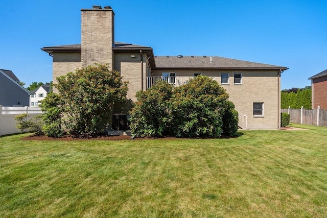 6 Gavin Cir, Stoneham, MA 02180 - rear view of house with a chimney