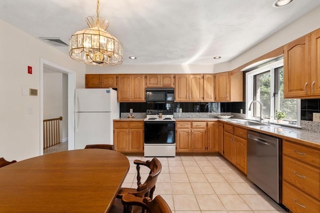 6 Gavin Cir, Stoneham, MA 02180 - kitchen featuring white appliances, tasteful backsplash, light countertops, a chandelier, and light tile patterned floors