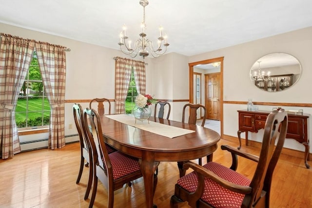 8 Adams Rd, Grafton, MA 01519 - dining area featuring a chandelier, healthy amount of natural light, and light wood-style flooring