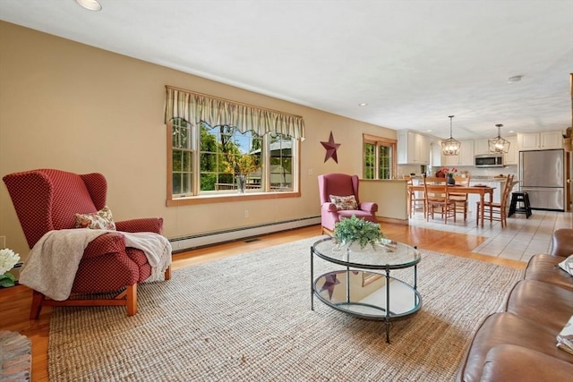 8 Adams Rd, Grafton, MA 01519 - living area featuring light wood-style flooring, a baseboard radiator, and recessed lighting