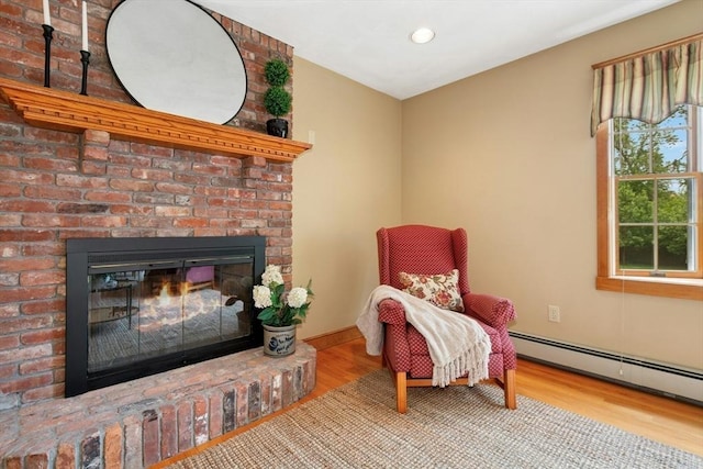 8 Adams Rd, Grafton, MA 01519 - living area with a brick fireplace, wood finished floors, baseboard heating, and recessed lighting
