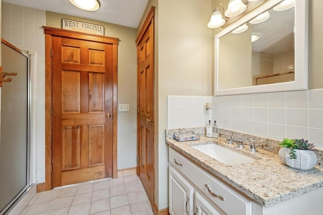 8 Adams Rd, Grafton, MA 01519 - full bathroom featuring vanity, a stall shower, tile patterned floors, and decorative backsplash