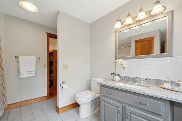 8 Adams Rd, Grafton, MA 01519 - bathroom with vanity, backsplash, toilet, tile patterned floors, and baseboards