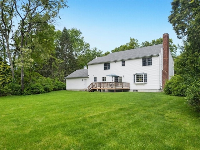 8 Adams Rd, Grafton, MA 01519 - back of property with a chimney, a yard, and a deck