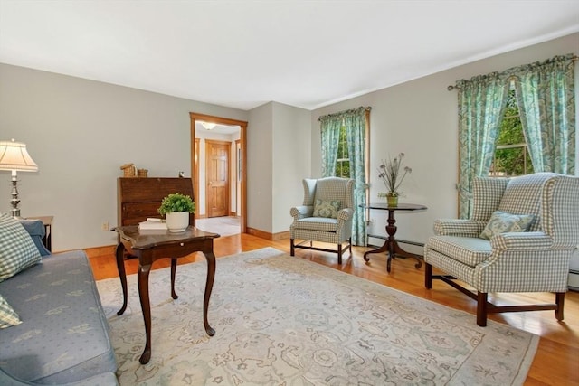 8 Adams Rd, Grafton, MA 01519 - living area with light wood-type flooring and baseboard heating