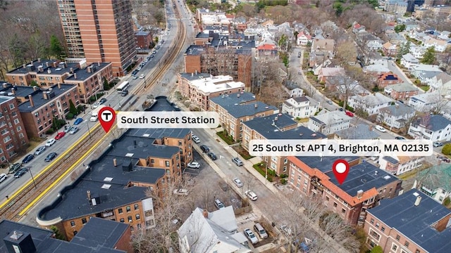 view of property location with nearby urban area and a major roadway