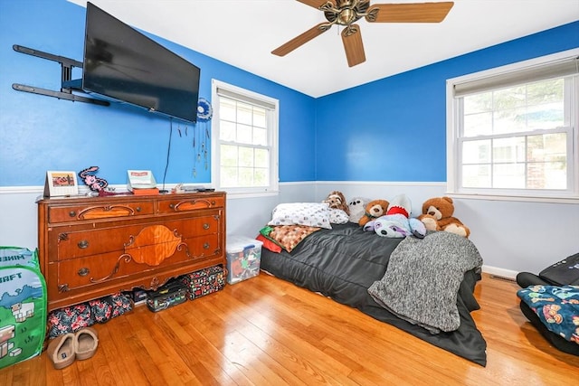 bedroom featuring a ceiling fan and wood-type flooring