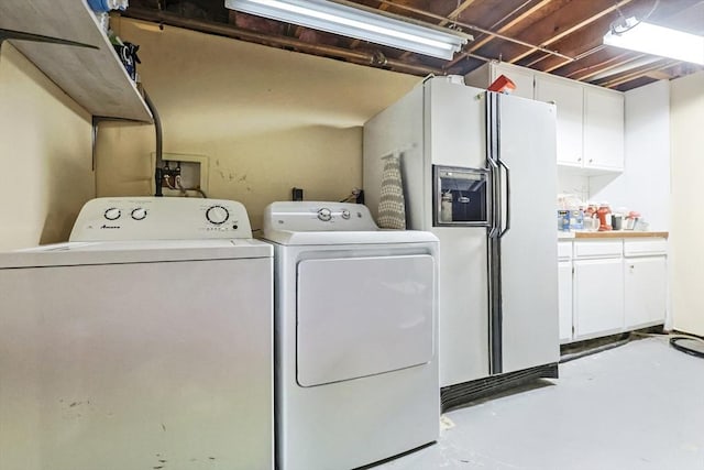 clothes washing area with independent washer and dryer