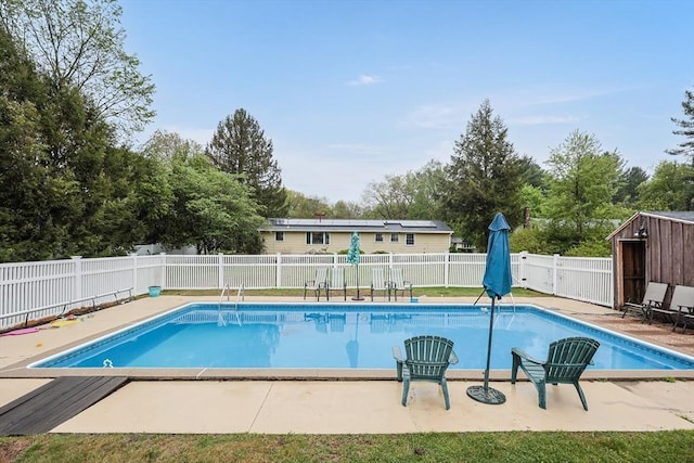 view of pool with a patio, a fenced in pool, and a fenced backyard