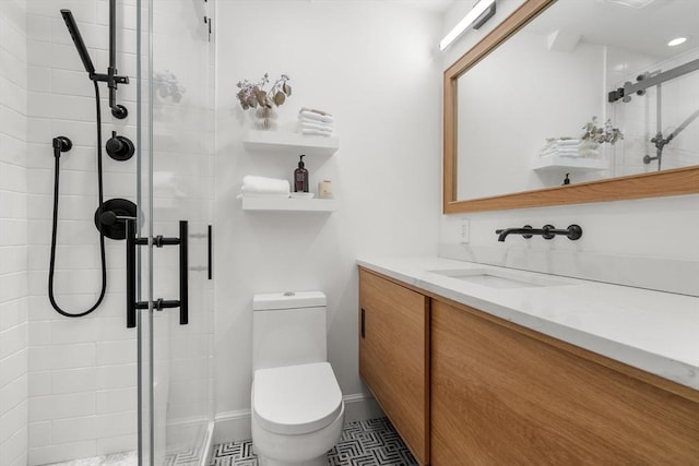 full bathroom with a shower stall, toilet, and vanity