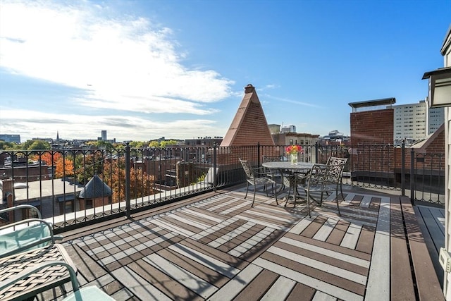 wooden terrace with a view of city