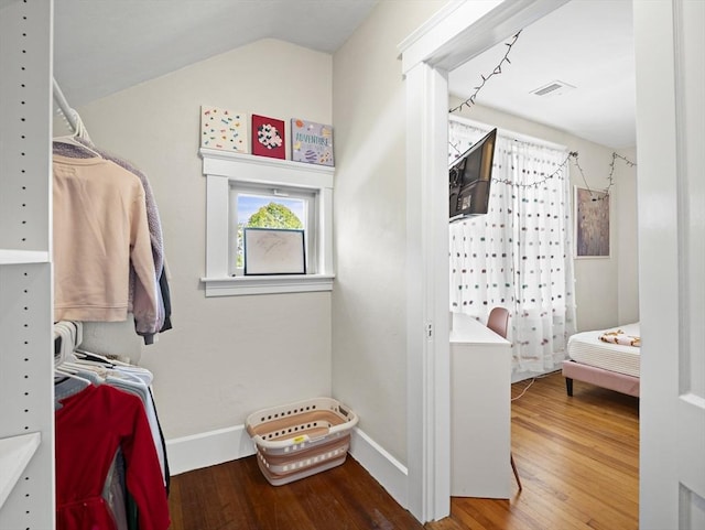 537 Milk St, Fitchburg, MA 01420 - walk in closet featuring wood finished floors and vaulted ceiling
