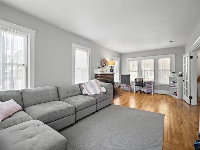 537 Milk St, Fitchburg, MA 01420 - living area featuring plenty of natural light and wood finished floors