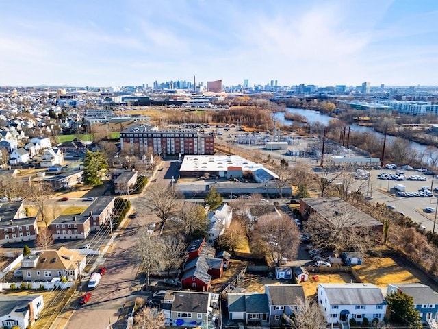 birds eye view of property with a water view and a city view