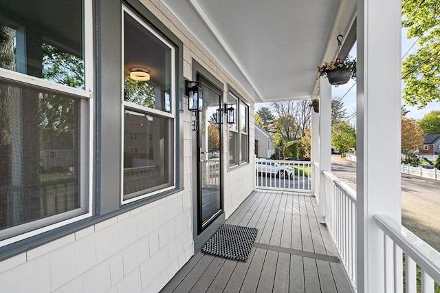 wooden deck featuring covered porch