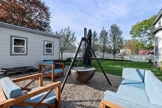 exterior space featuring a fenced backyard, a patio area, and outdoor lounge area