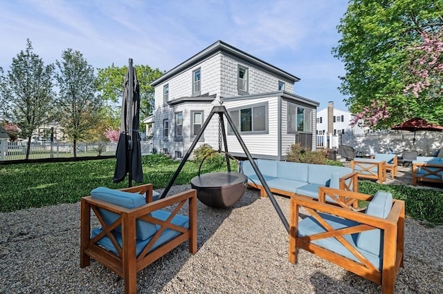view of playground with a patio, outdoor lounge area, and fence