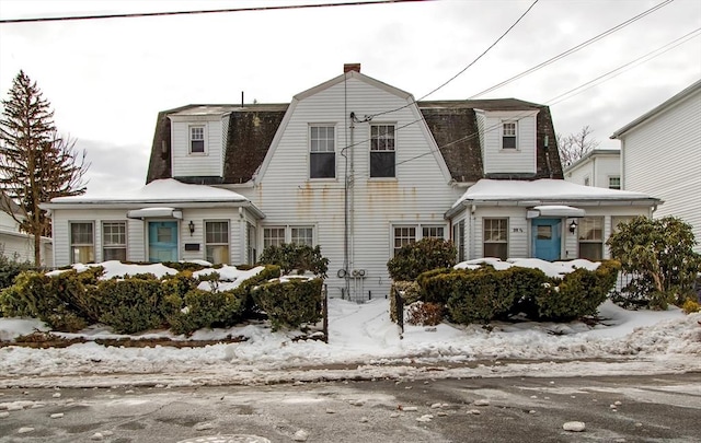 colonial inspired home with a gambrel roof