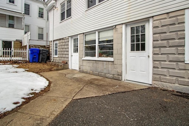 doorway to property with fence