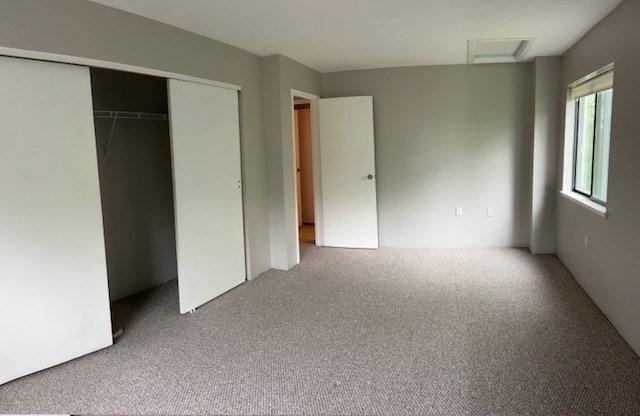 14 Village Way Unit 23, Natick, MA 01760 - unfurnished bedroom featuring carpet, attic access, and a closet