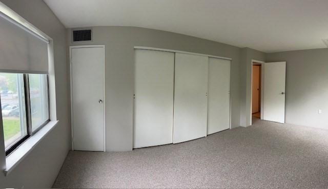 14 Village Way Unit 23, Natick, MA 01760 - unfurnished bedroom with multiple windows and carpet floors