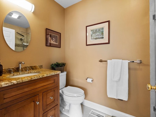 bathroom featuring visible vents, baseboards, walk in shower, toilet, and vanity