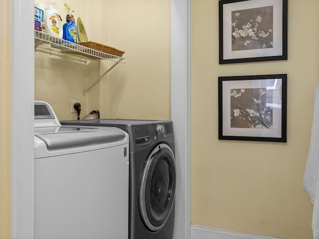 laundry area with laundry area and separate washer and dryer