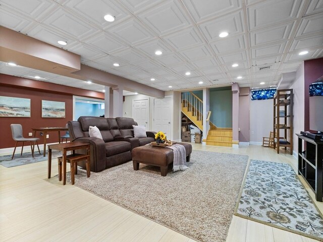 living room with stairs, visible vents, recessed lighting, and baseboards