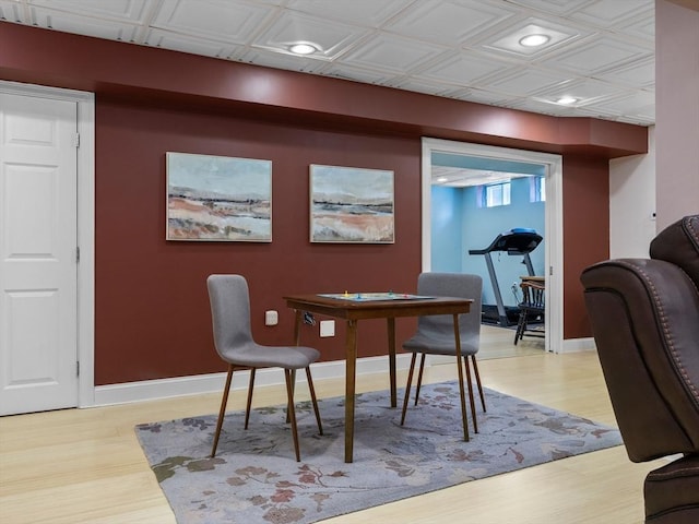 dining space with light wood finished floors, recessed lighting, baseboards, and an ornate ceiling