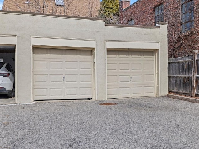 garage with fence