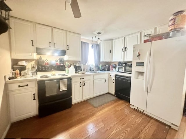 4 Royal Dane Dr Unit 19, Marshfield, MA 02050 - kitchen with white refrigerator with ice dispenser, electric stove, black dishwasher, under cabinet range hood, and white cabinetry