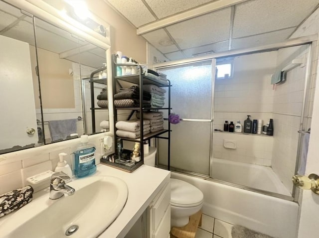 4 Royal Dane Dr Unit 19, Marshfield, MA 02050 - bathroom with vanity, toilet, shower / bath combination with glass door, tile patterned floors, and a paneled ceiling