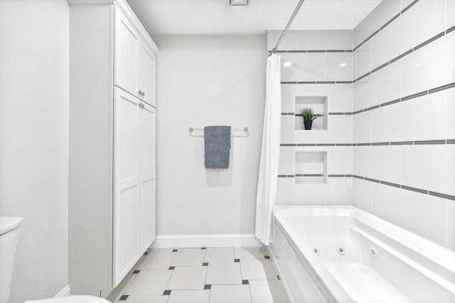 49 Baldwin St Unit 1, Boston, MA 02129 - bathroom with toilet, baseboards, a combined bath / shower with jetted tub, and tile patterned floors