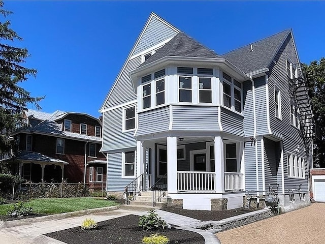 view of front of property with roof with shingles